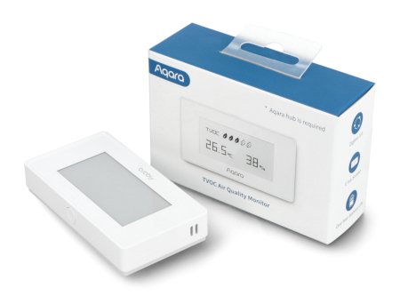 Ein weißer Luftqualitätssensor mit Display liegt zusammen mit einem Kästchen auf weißem Hintergrund.
